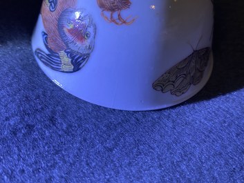A Chinese famille rose 'bird and insects' cup and saucer, Yongzheng